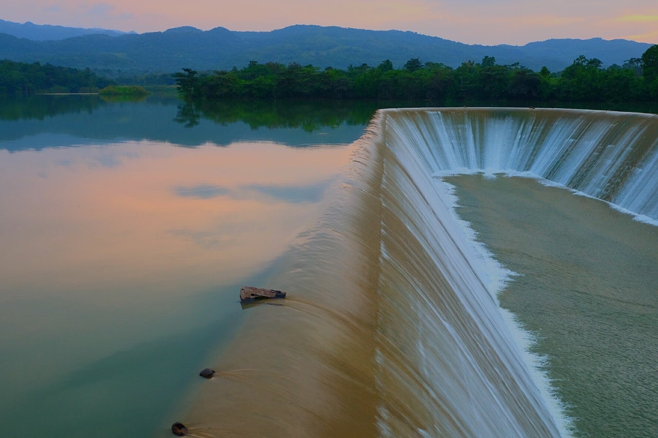 Scenic View Of Dam By Lake Against Sky