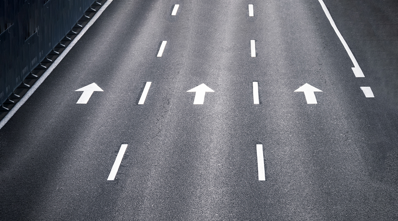 Asphalt road with arrow sign