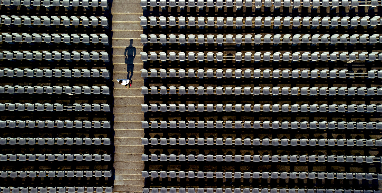 Man running down steps on arena