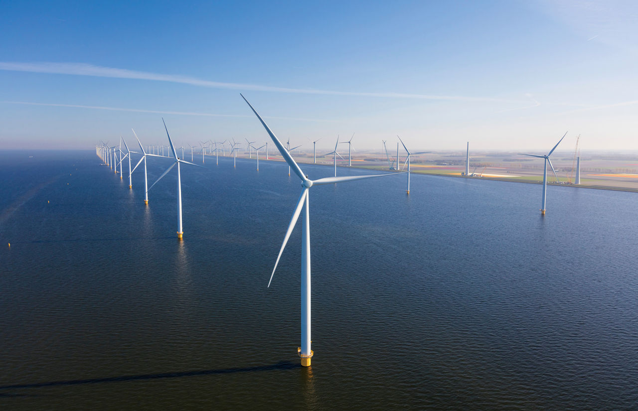 Aerial view of wind turbines at sea, North Holland, Netherlands