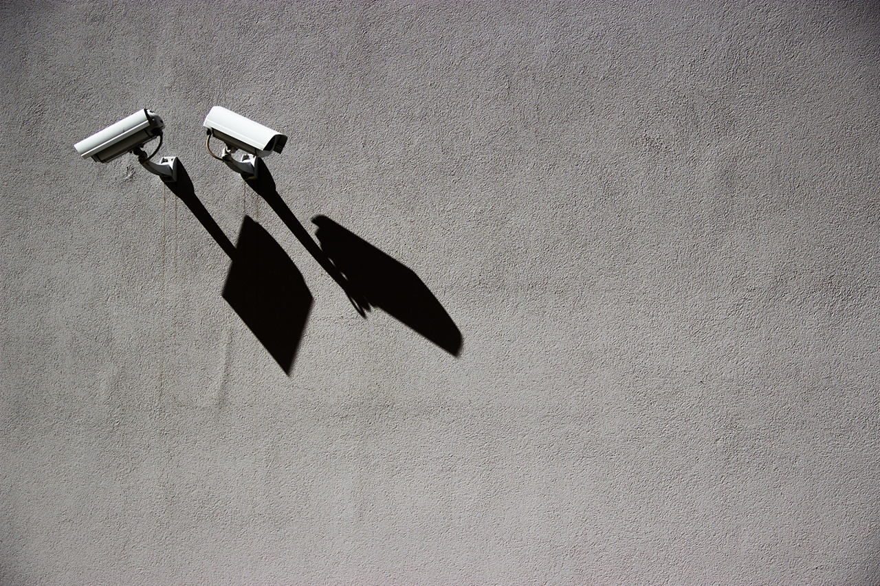 Security Cameras On Wall With Shadows