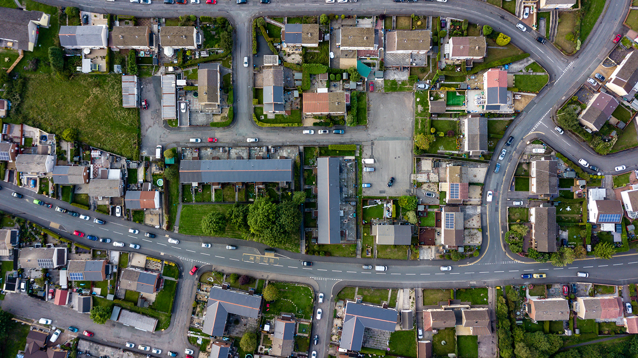 Top down aerial view of urban houses and streets in a residential area of a Welsh town