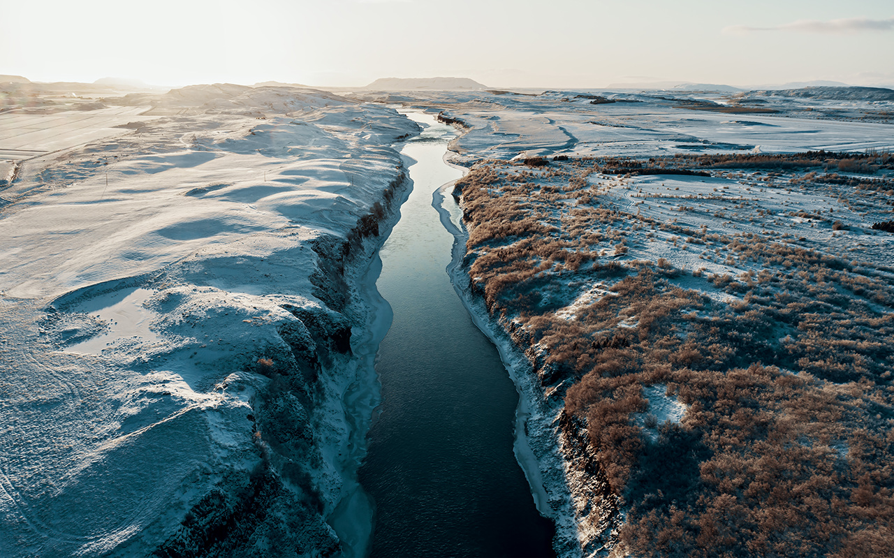 Aerial view of a river in Iceland with turquoise water, Melting Ice, Climate Change and Global Warming Concept 