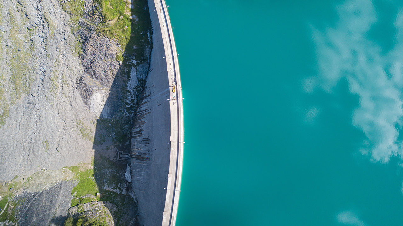 Aerial view of the dam of the Lake Barbellino, an Alpine artificial lake. Italian Alps. Italy