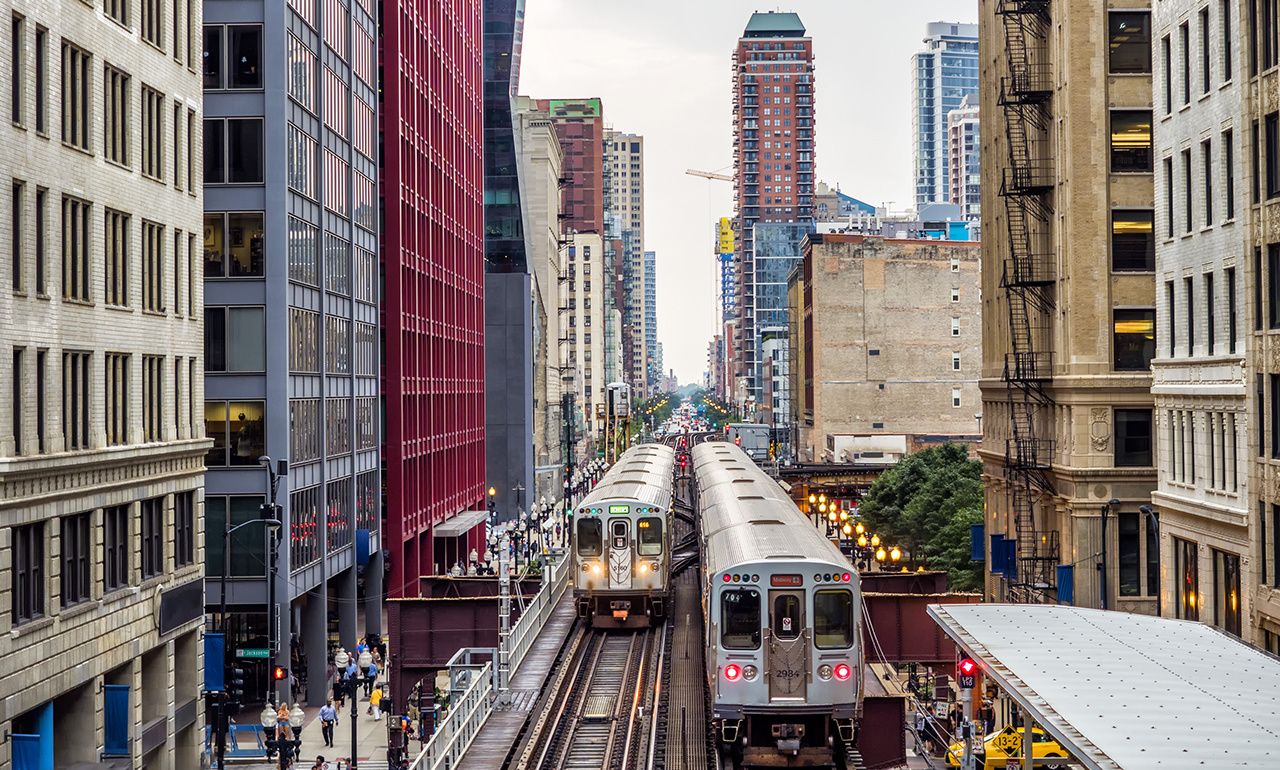 Elevated Train Tracks above the streets and between buildings at The Loop - Chicago, Illinois, USA