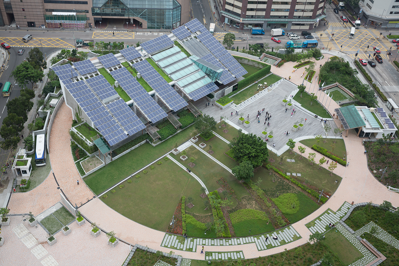 It is Hong Kong's first zero carbon building. Many solar panels on a building roof.