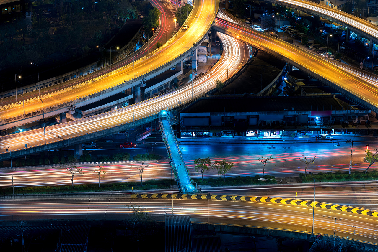 Motorway, Expressway, Freeway the infrastructure for transportation in modern city, urban view at night time