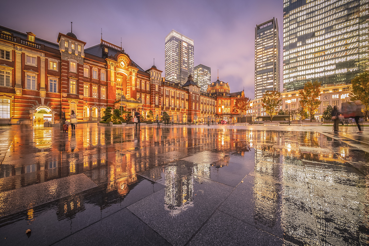 Tokyo station with reflection in raining day