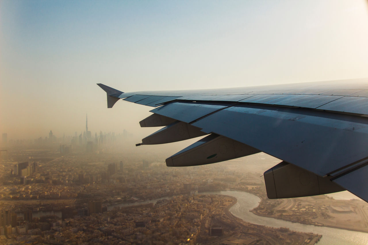 Close-Up Of Aircraft Wing Against Sky During Sunset