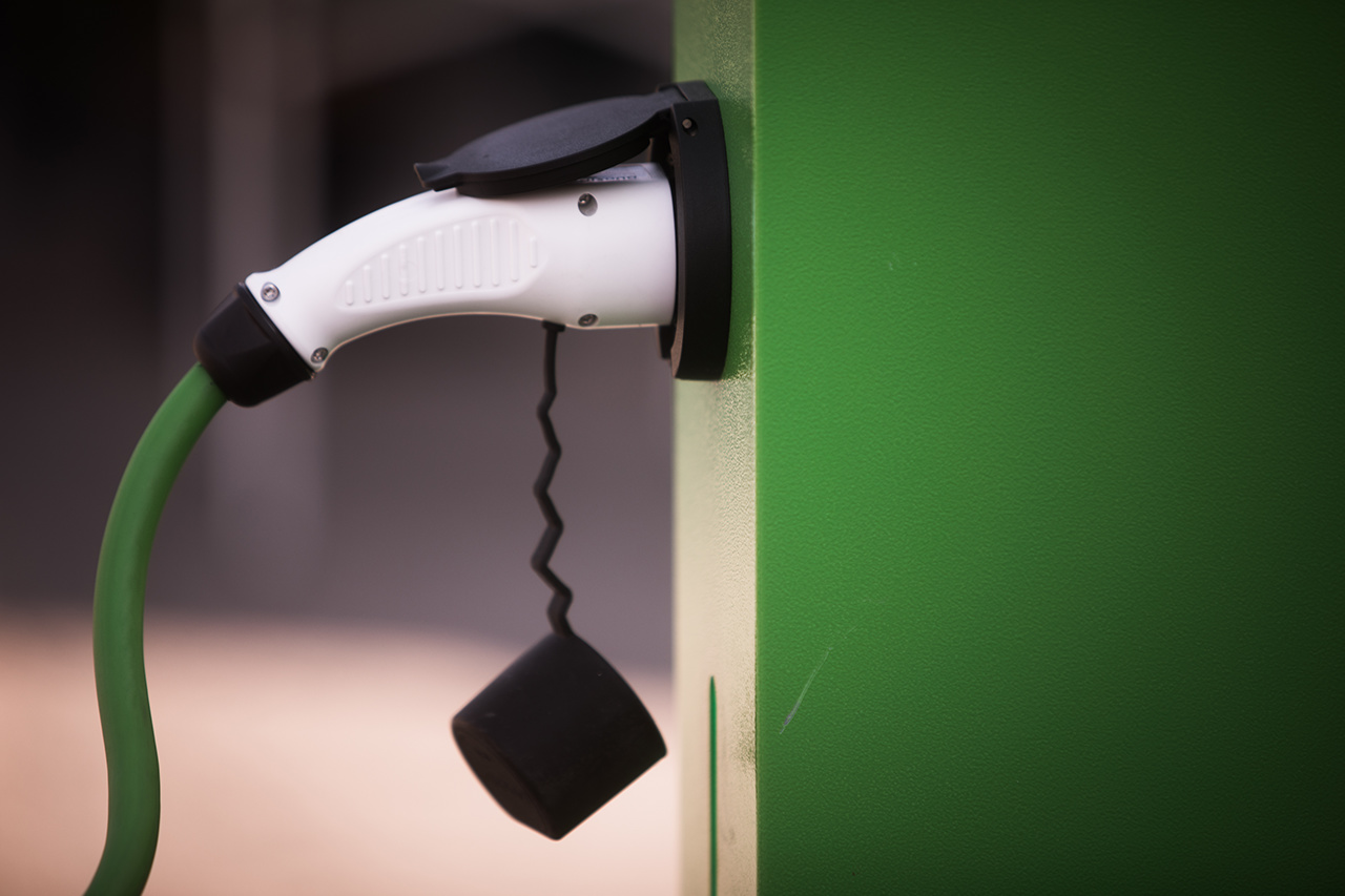 Close up image of an electrical charging station for a car.