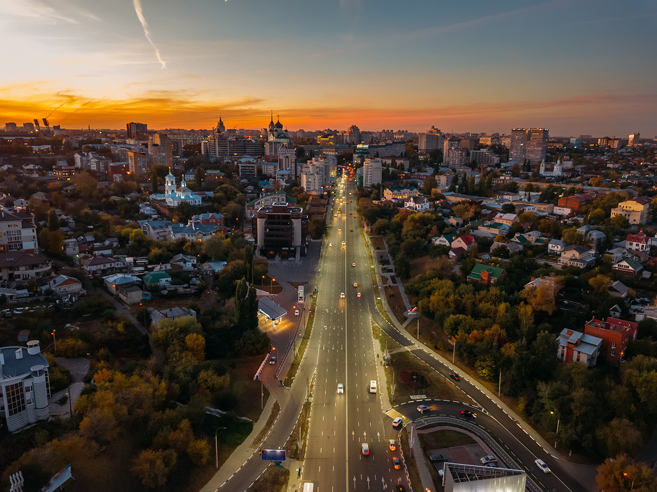 Night Voronezh, aerial view of city with illuminated road.