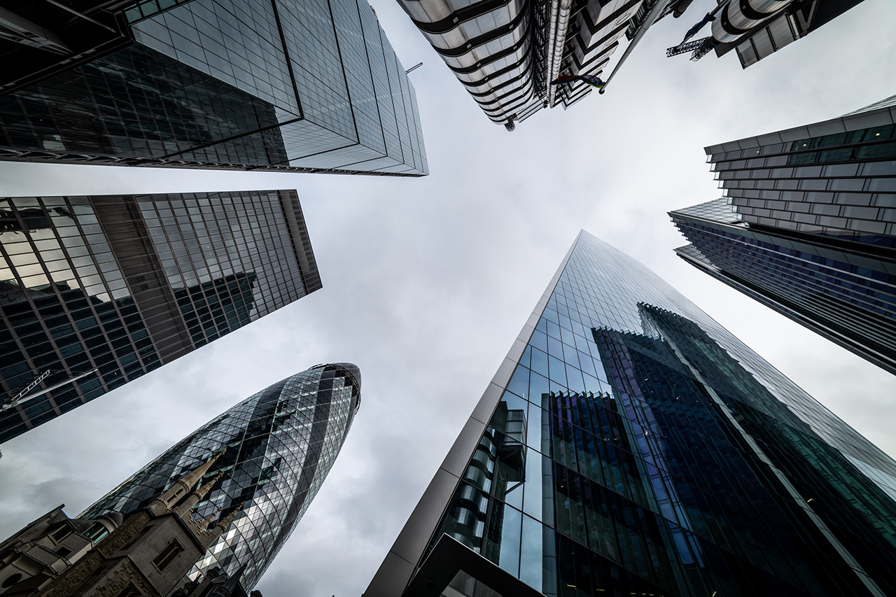 Low angle view of skyscrapers. Looking up perspective. Bottom view of modern skyscrapers in business district. Business concept of success industry