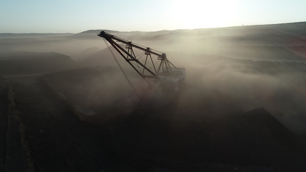 Coal mining in open pit excavator dust