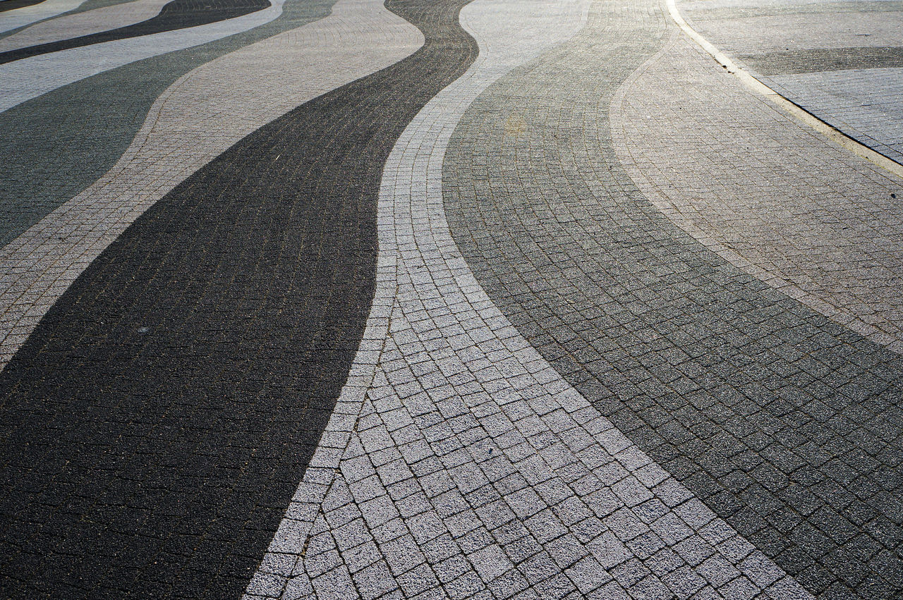 Wavy lines of modern pavement. Abstract textured background.