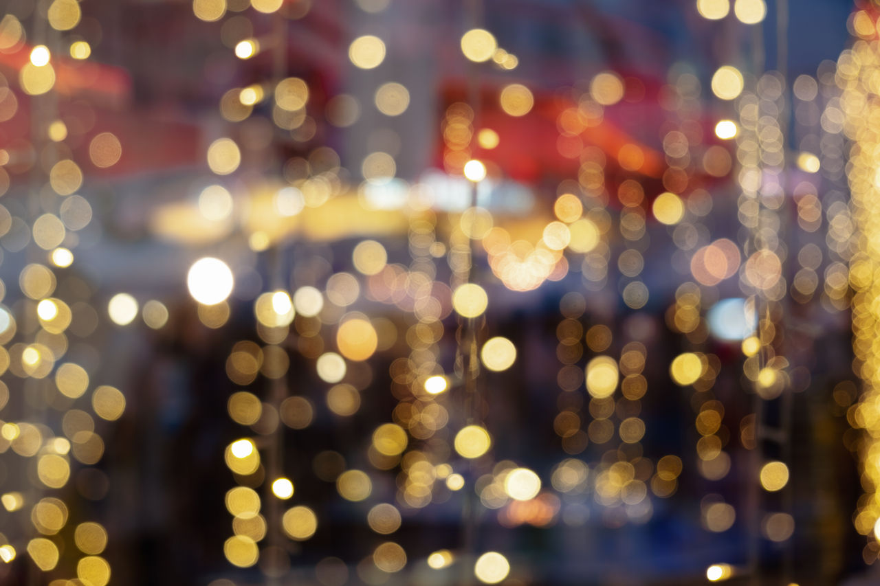 Blurred of Christmas light bokeh for backdrop design , Abstract blur gold bokeh background