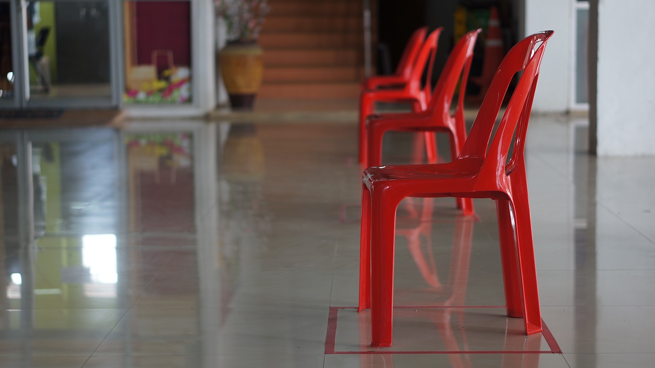 close up red chairs social distancing
