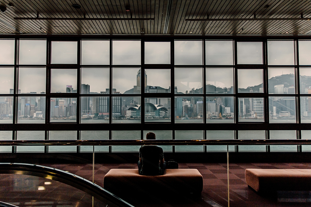 Rear View Of Man Sitting On Sofa At Hong Kong Museum Of Art