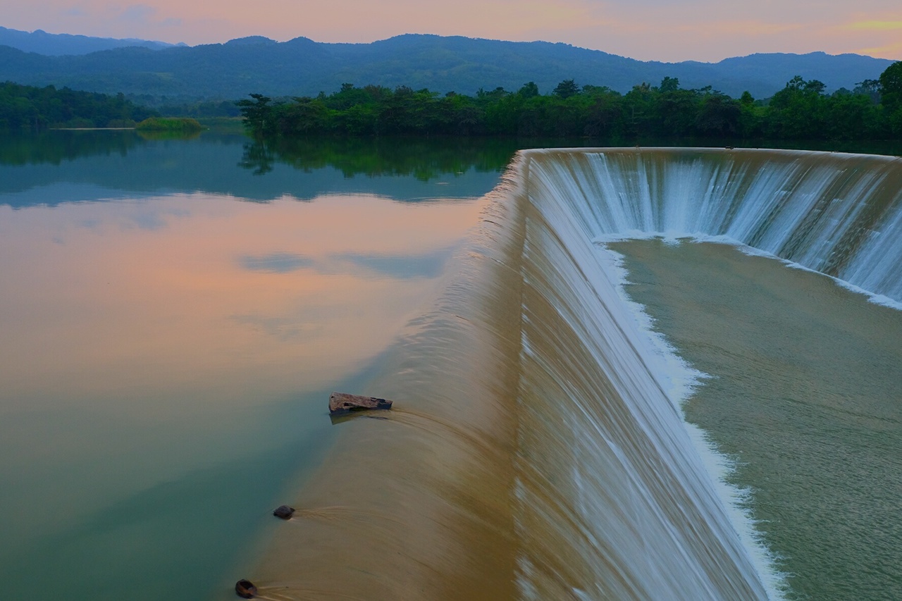 Scenic View Of Dam By Lake Against Sky