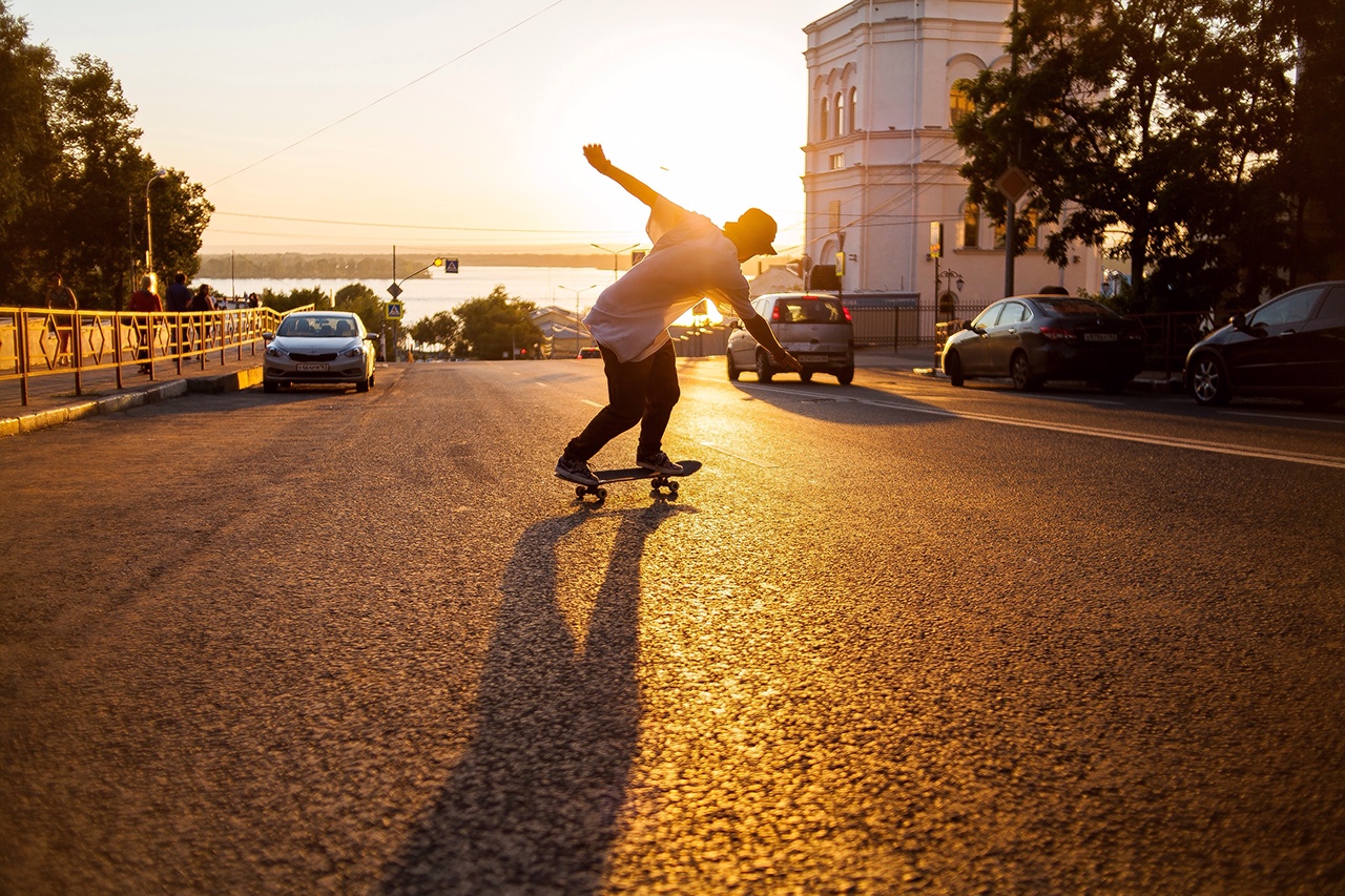 Rear View Full Length Of Man Skateboarding On Road During Sunset8