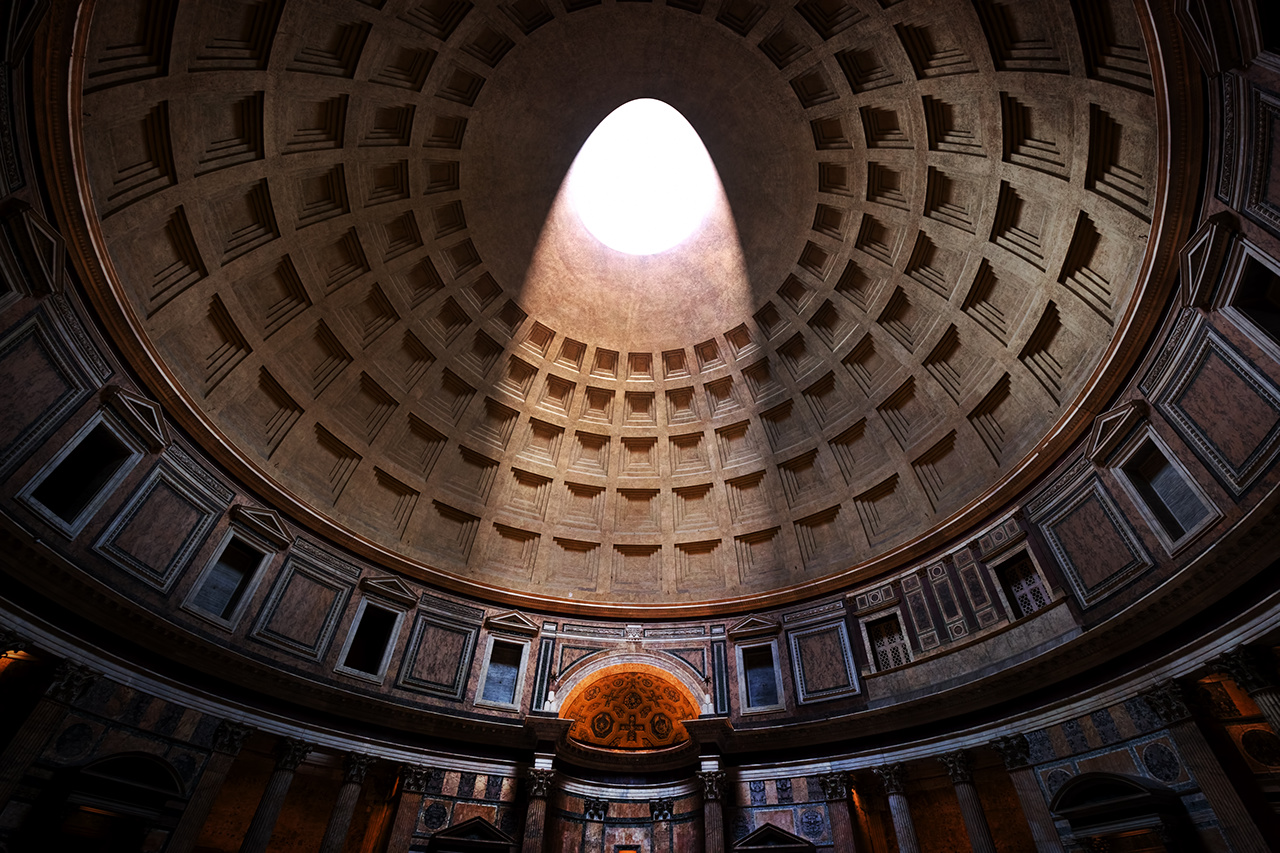 Inside the Pantheon in Rome, Italy. Light shining through a famous central opening, oculus in the ceiling